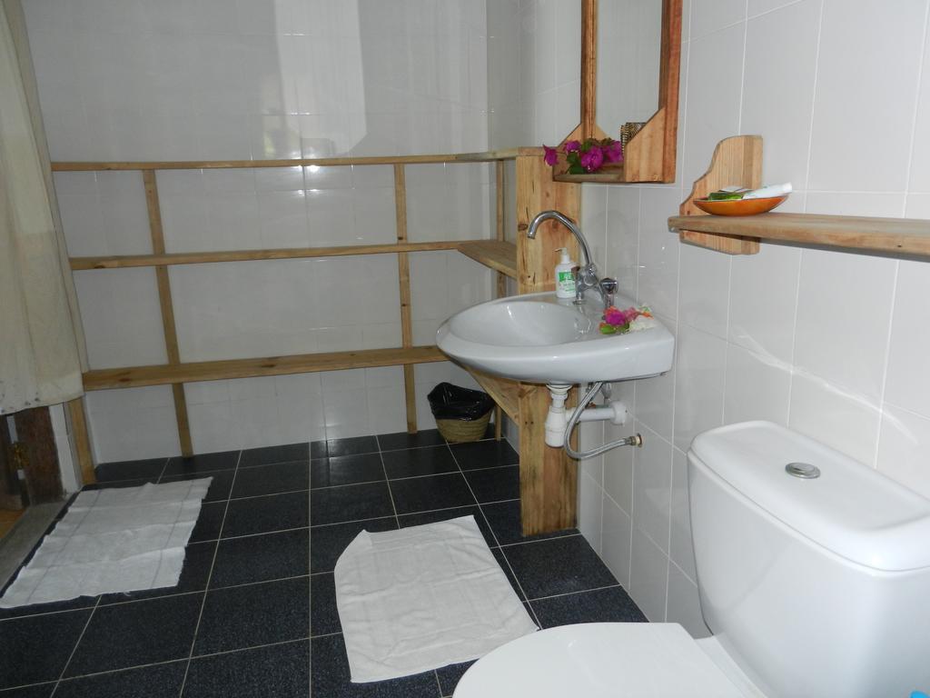 Вилла Amka House Джамбиани Номер фото